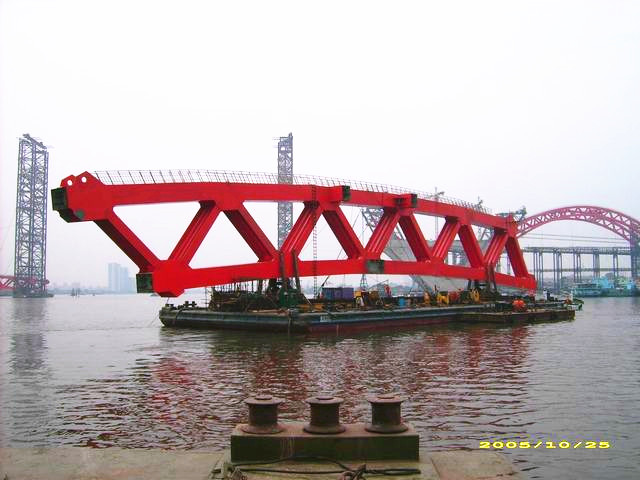 Pulling and Moving of the Main Arch Rib Steel Structures of Xin Guang Bridge