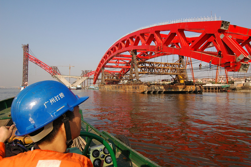 Pulling and Moving of the Main Arch Rib Steel Structures of Xin Guang Bridge